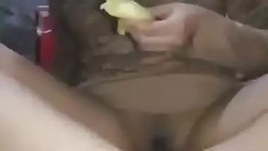 Indian girl masturbates using a banana and eats it