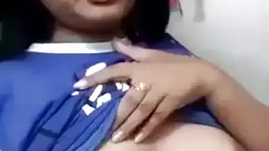 Beautiful desi girl lifting top to reveal sexy boobs